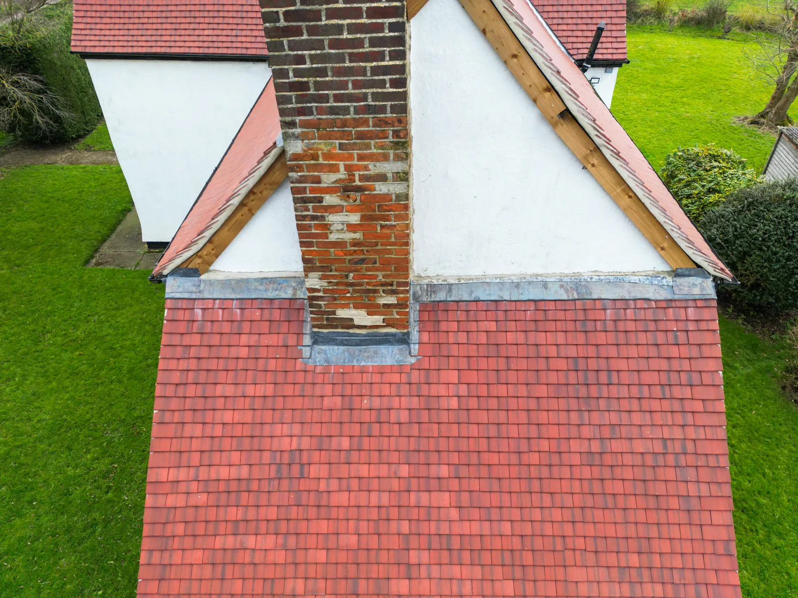 Clay tile roof and brick chimney